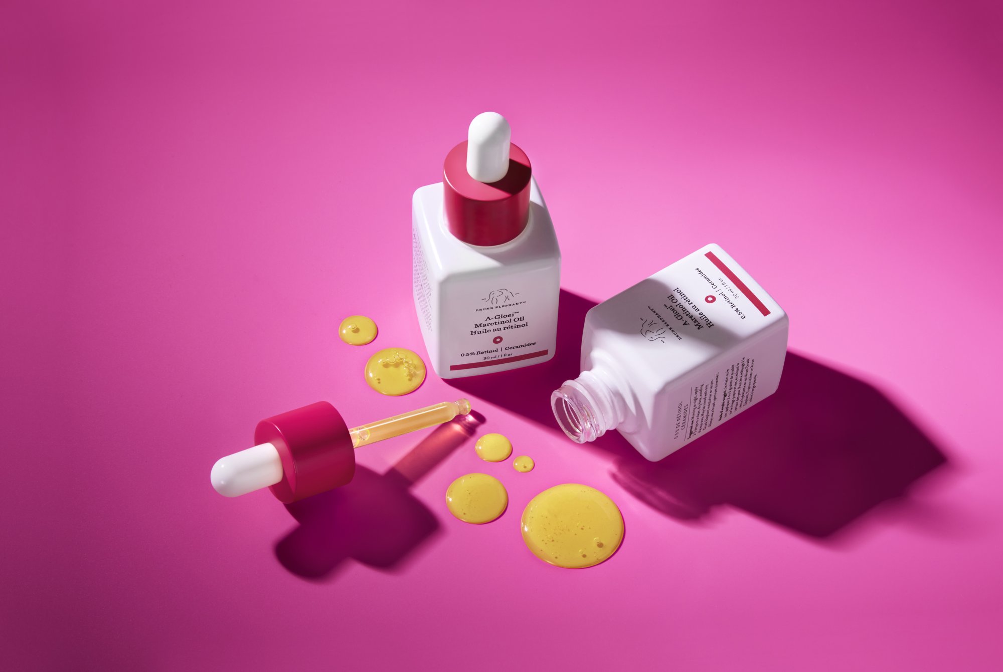 Drunk Elephant skincare products on pink background 